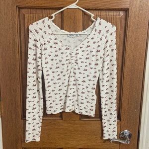 Beautiful white floral long sleeve with rouching in the middle